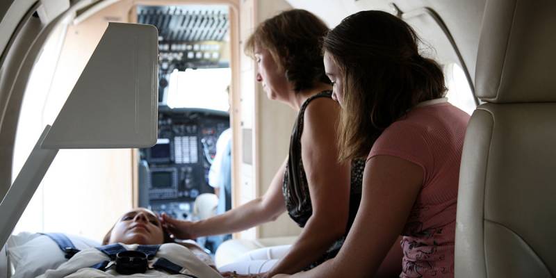 Air Critical Care staff with a patient and family